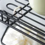 wall caddy with hooks and storage shelf