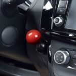 joystick push start cover on car dashboard